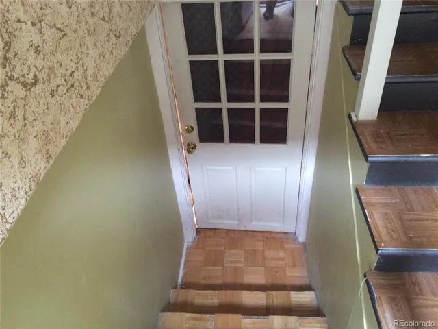 a kitchen with a stove and a refrigerator