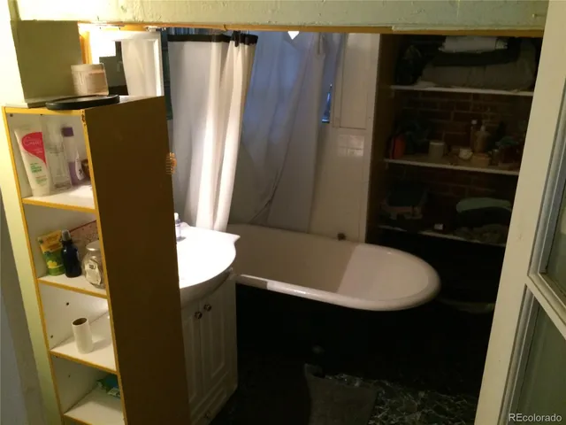 a kitchen with granite countertop a sink and a stove