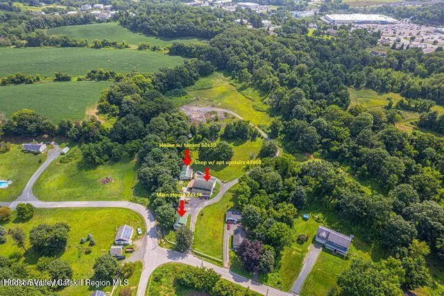 an aerial view of a golf course with a lake view