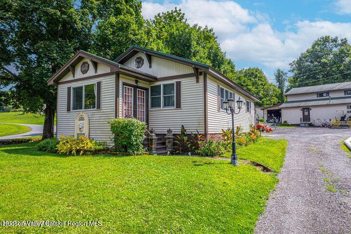 104 Lord Avenue Troy, NY 12180 - Photo 5 of 10 a front view of a house with garden