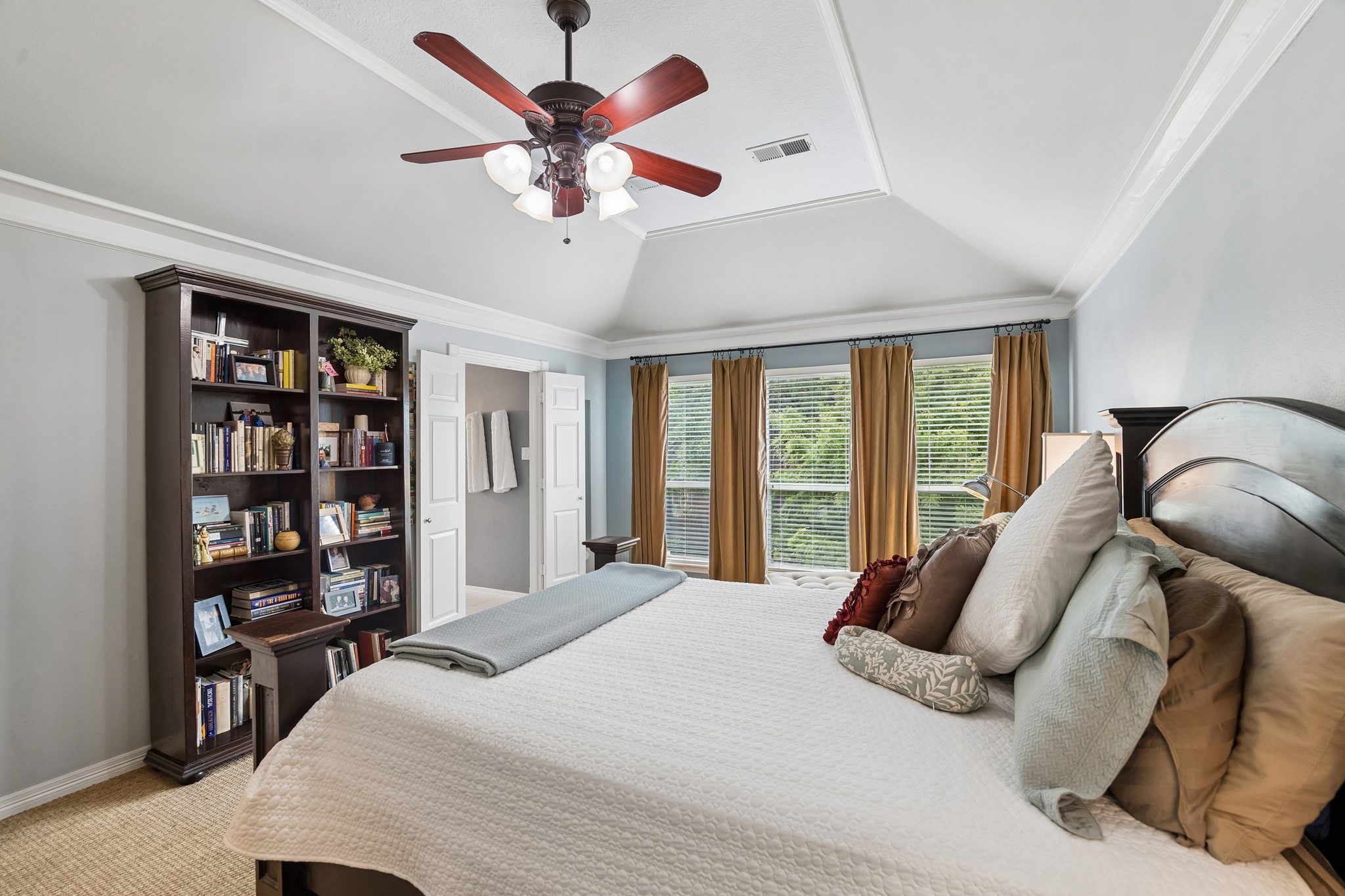 5918 Center Ct Drive Spring, TX 77379 - Photo 15 of 32 a bedroom with a large bed and a chandelier