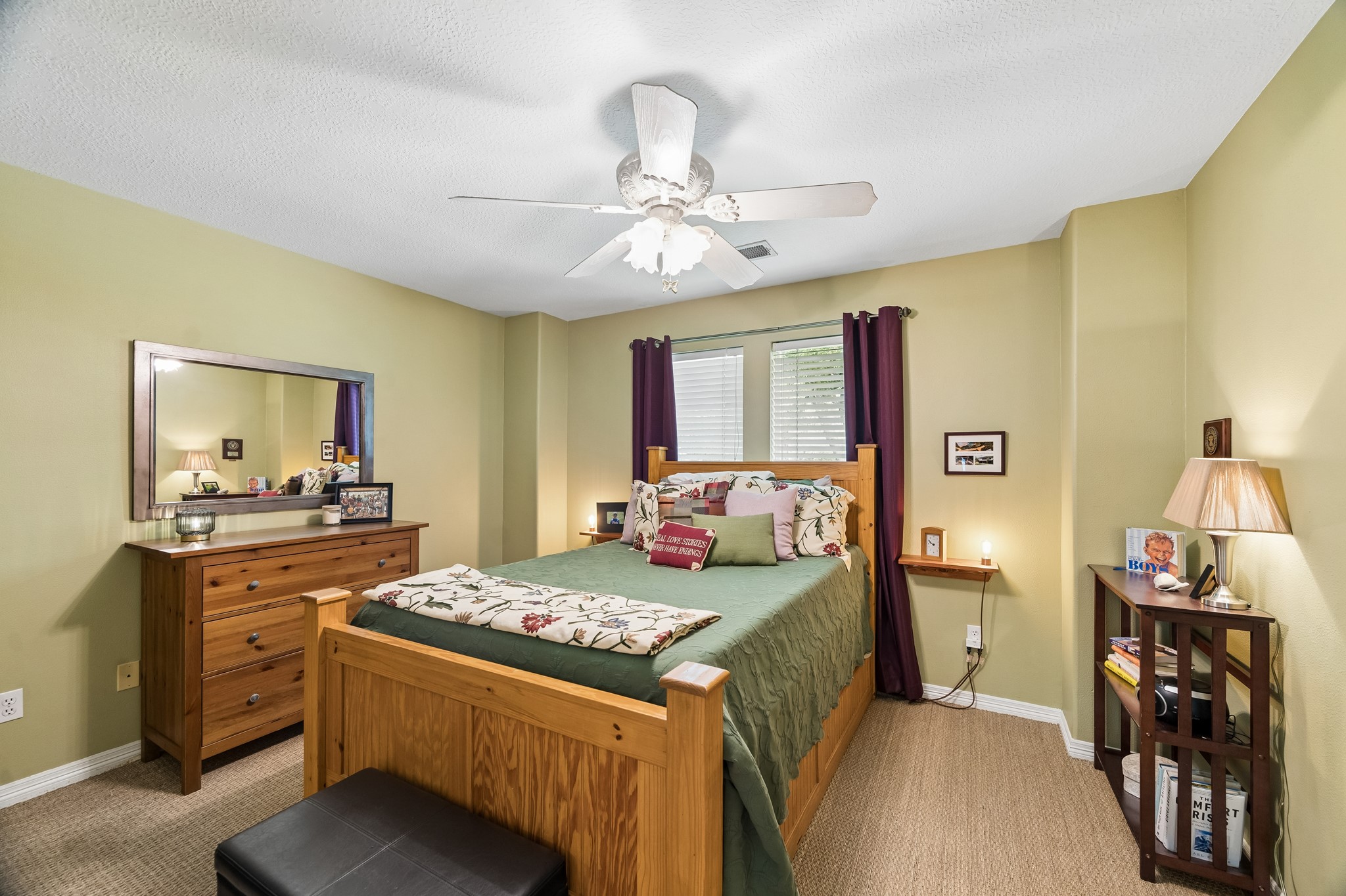 5918 Center Ct Drive Spring, TX 77379 - Photo 18 of 32 a bedroom with a bed and a chandelier