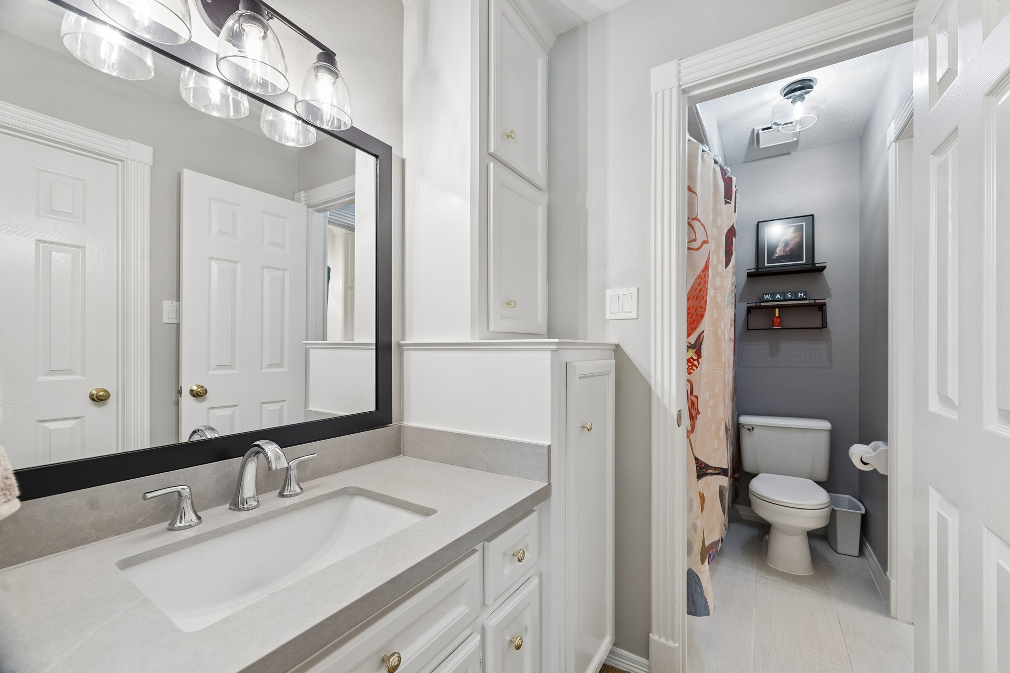 5918 Center Ct Drive Spring, TX 77379 - Photo 22 of 32 a bathroom with a sink and a mirror