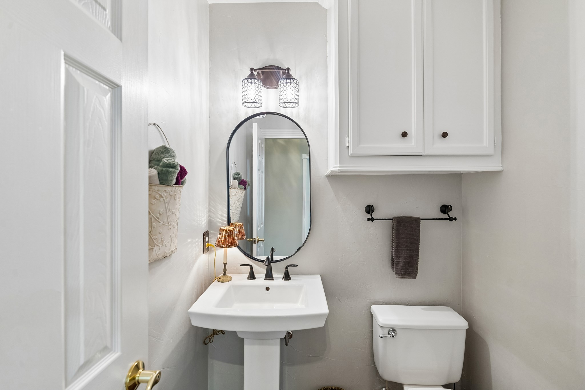 5918 Center Ct Drive Spring, TX 77379 - Photo 27 of 32 a bathroom with a toilet sink and mirror