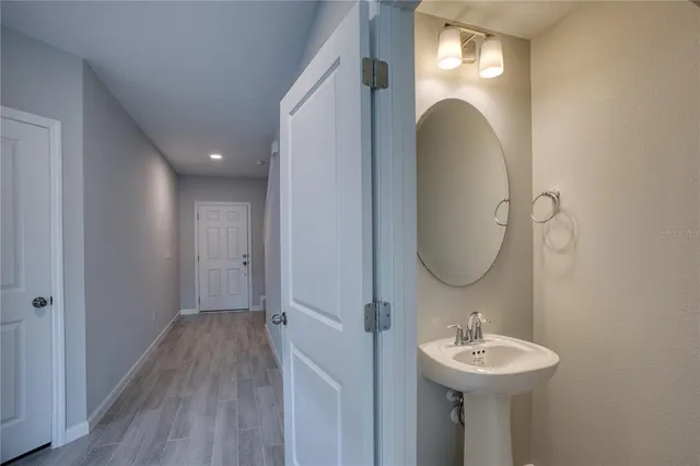 a bathroom with a sink and mirror