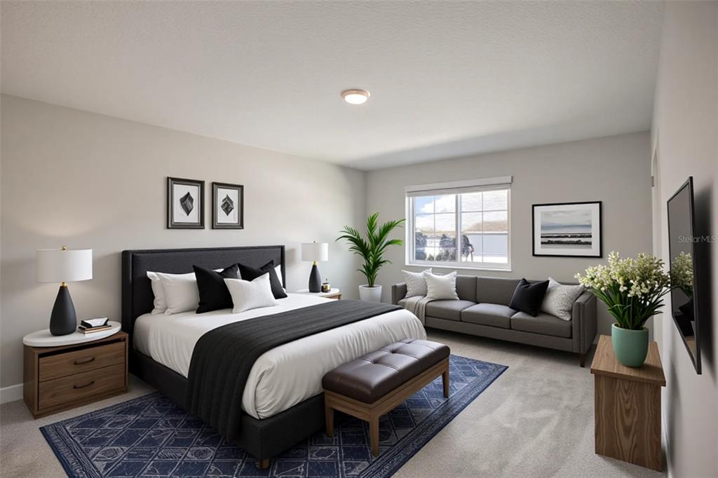 4188 Campsite Loop Orlando, FL 32824 - Photo 17 of 38 a spacious bedroom with a bed and a couch