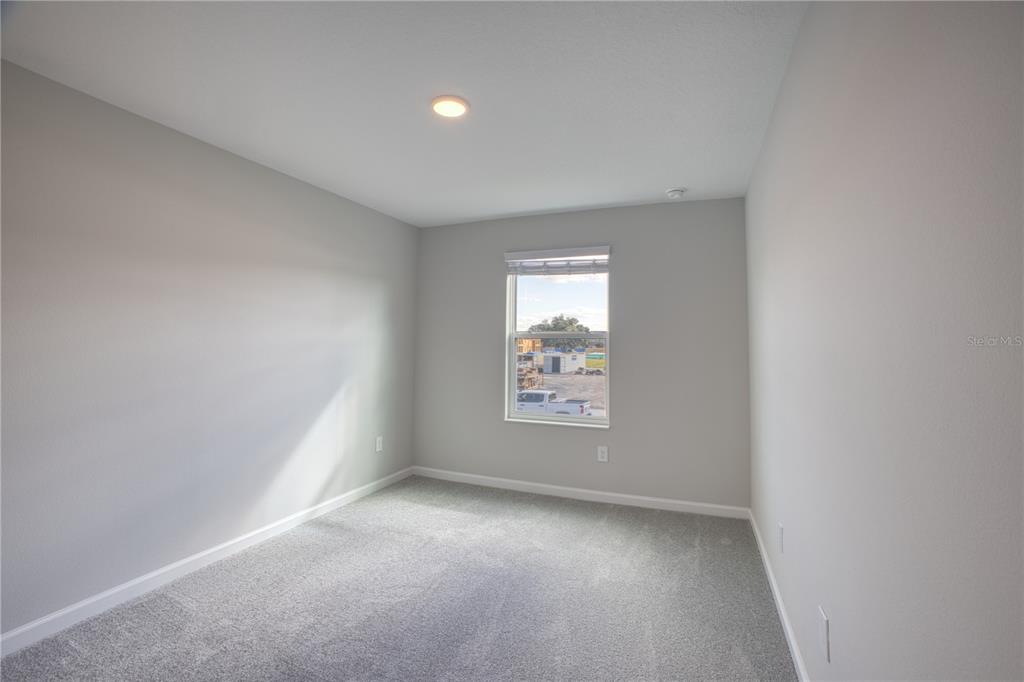 4188 Campsite Loop Orlando, FL 32824 - Photo 22 of 38 an empty room with windows