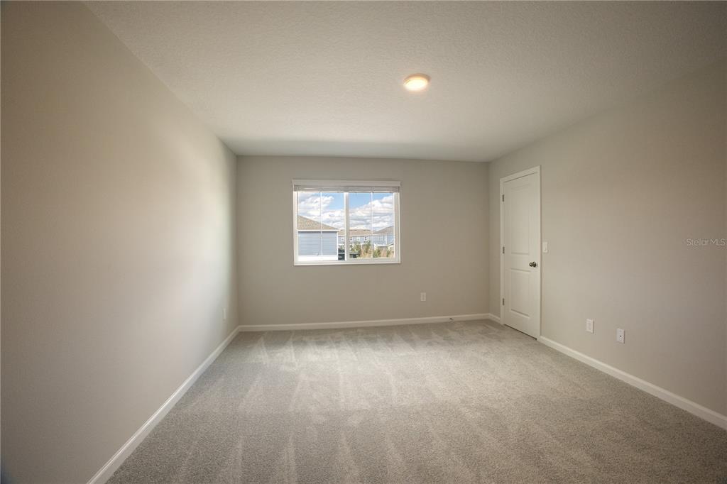 4188 Campsite Loop Orlando, FL 32824 - Photo 25 of 38 an empty room with a window