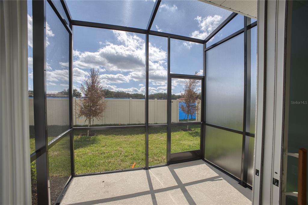 4188 Campsite Loop Orlando, FL 32824 - Photo 29 of 38 a view of a glass door with a floor to ceiling window
