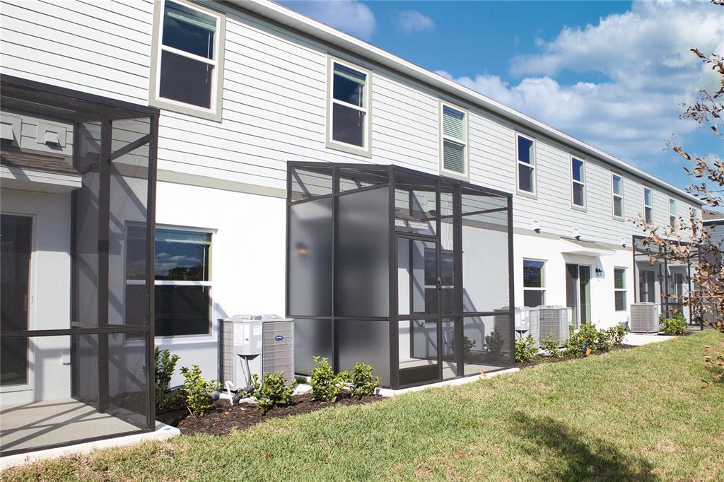 4188 Campsite Loop Orlando, FL 32824 - Photo 30 of 38 a front view of a house with garden
