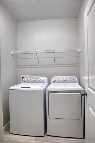 a utility room with washer and dryer