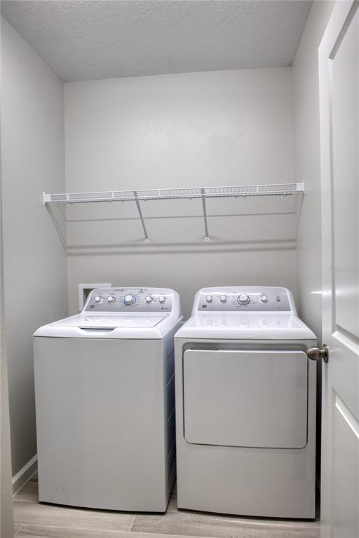 4188 Campsite Loop Orlando, FL 32824 - Photo 4 of 38 a utility room with washer and dryer