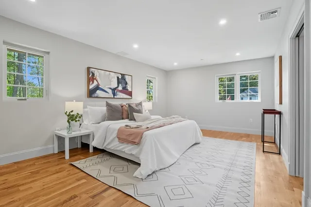 a bedroom with bed and a window