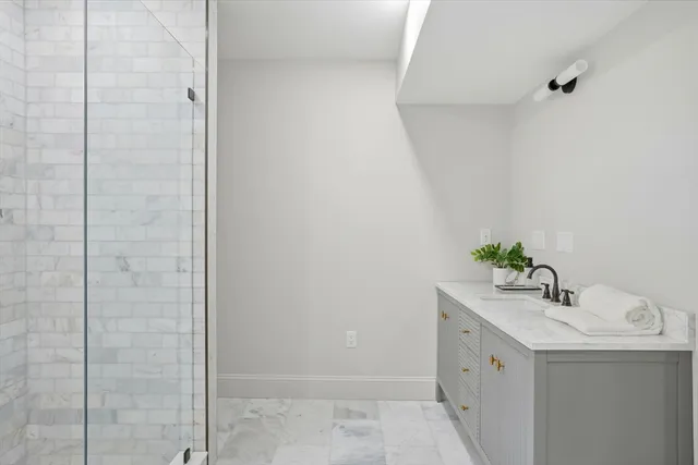 a bed room with a bed and a painting on the wall