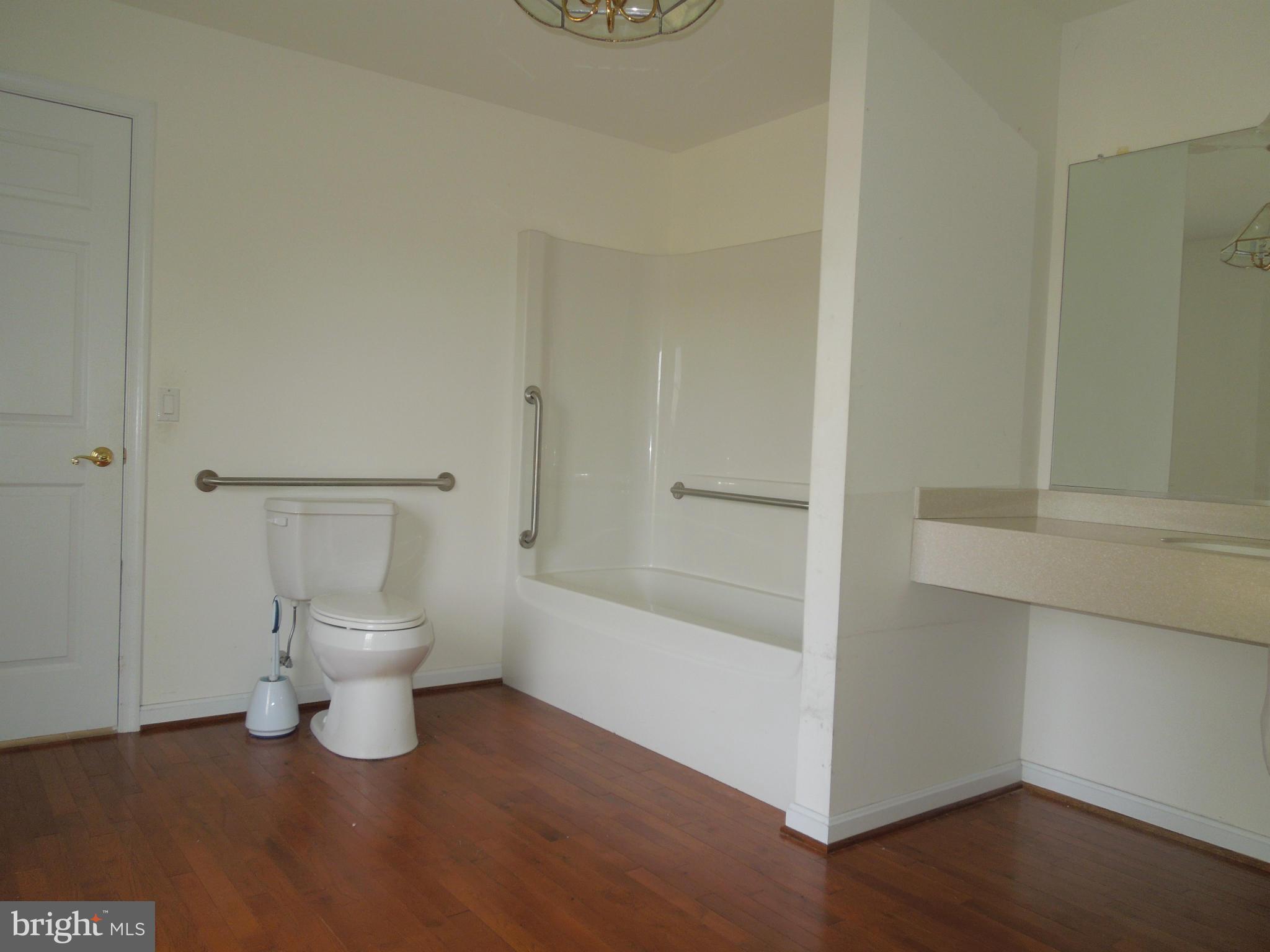 7465 Harmony Road Preston, MD 21655 - Photo 16 of 30 a bathroom with a toilet and a shower