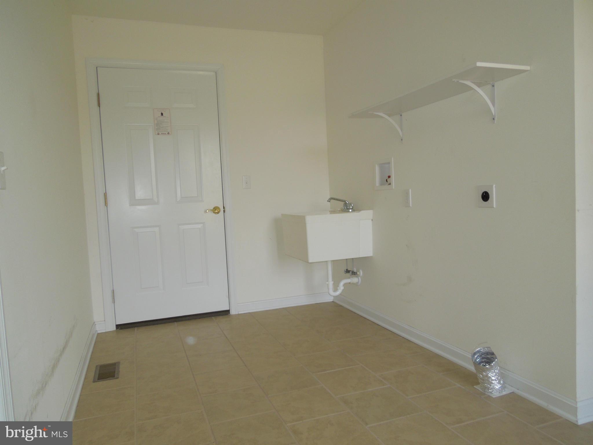 7465 Harmony Road Preston, MD 21655 - Photo 17 of 30 an empty room with a bench