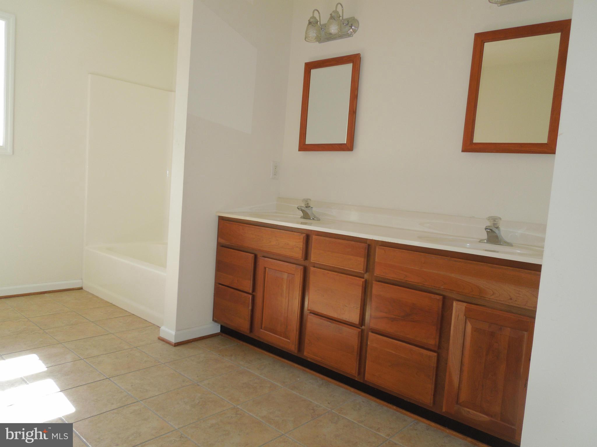 7465 Harmony Road Preston, MD 21655 - Photo 24 of 30 a bathroom with a sink and a mirror
