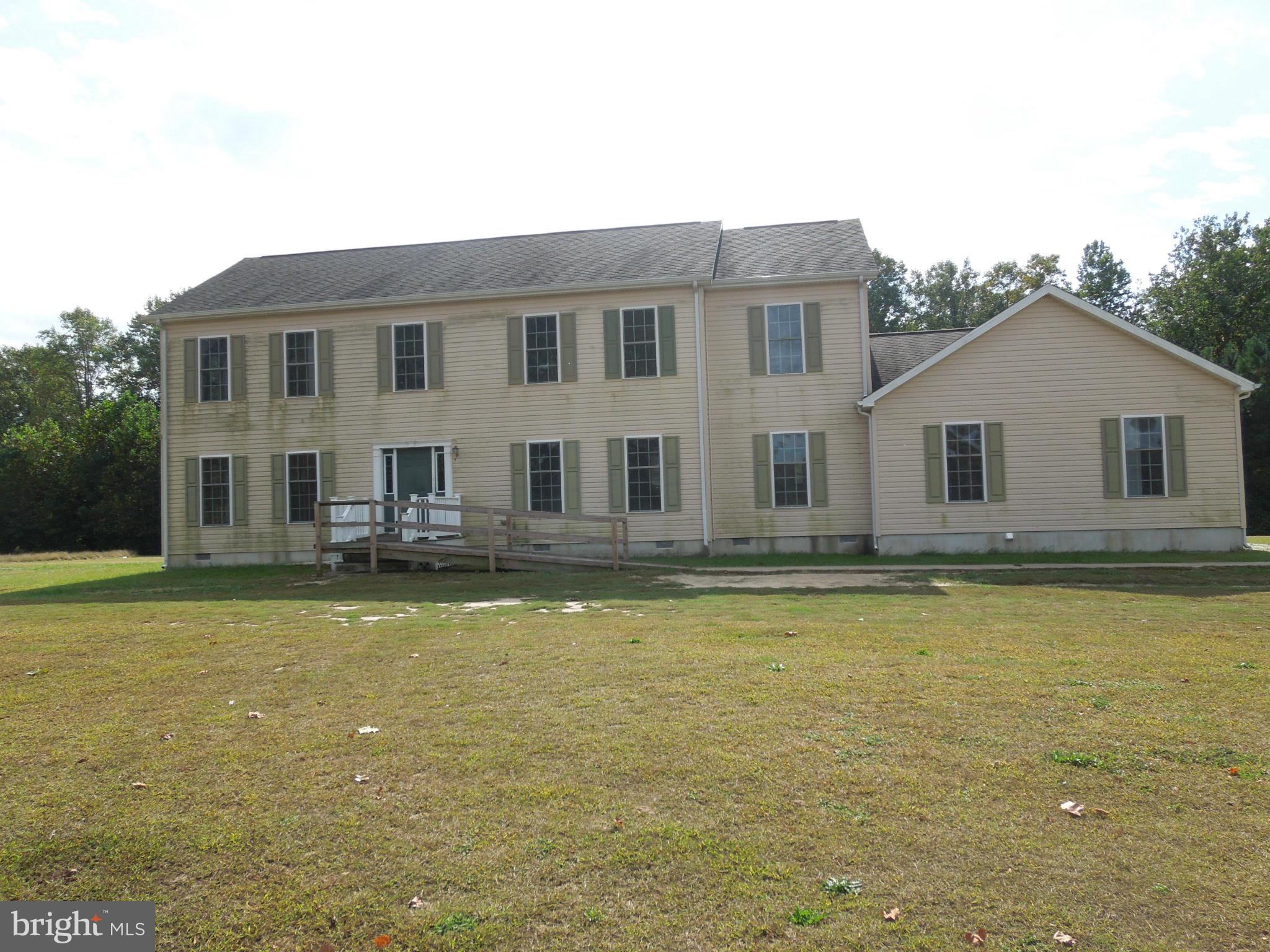 7465 Harmony Road Preston, MD 21655 - Photo 4 of 30 a front view of a house with swimming pool