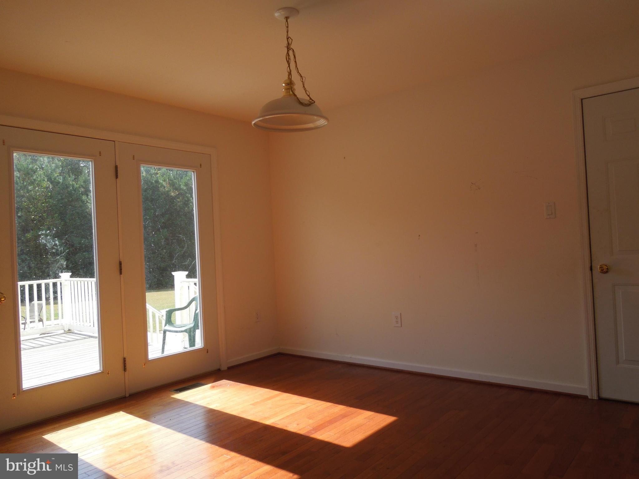 7465 Harmony Road Preston, MD 21655 - Photo 10 of 30 a view of an empty room with a window