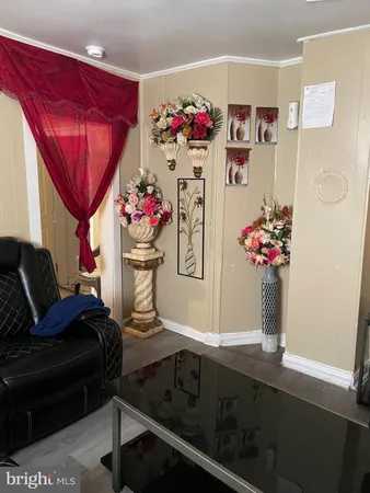 a living room with furniture flowerpot and flower pot