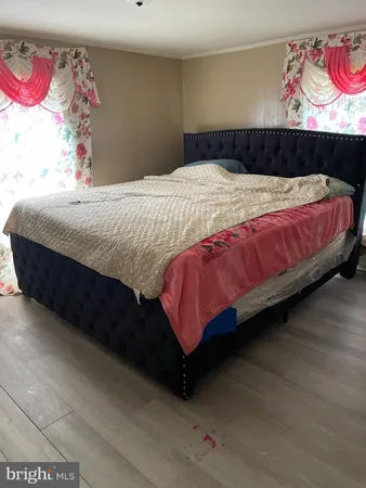 a bedroom with a bed and dresser