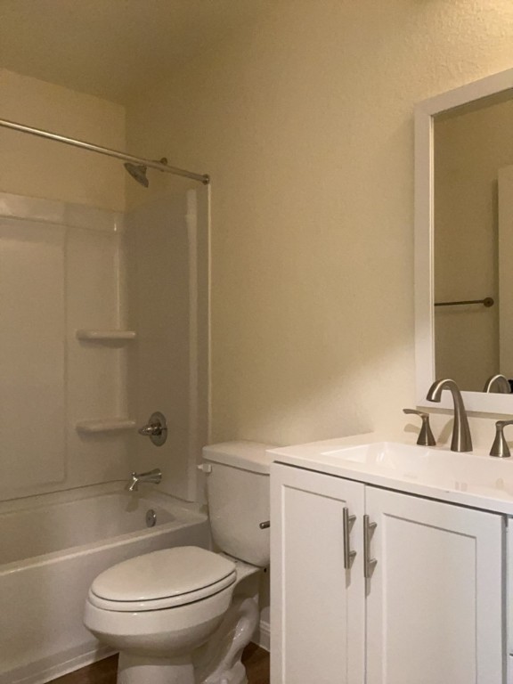 2002 West 2nd Street, Unit 1400 Taylor, TX 76574 - Photo 11 of 14 Full bathroom with vanity, shower / tub combination, and wood finished floors