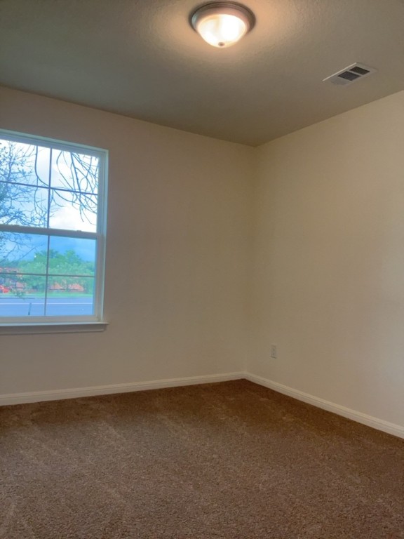 2002 West 2nd Street, Unit 1400 Taylor, TX 76574 - Photo 13 of 14 Bedroom with carpet and baseboards