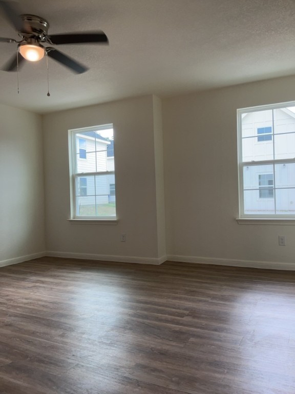 2002 West 2nd Street, Unit 1400 Taylor, TX 76574 - Photo 5 of 14 Living room featuring wood finished floors and ceiling fan