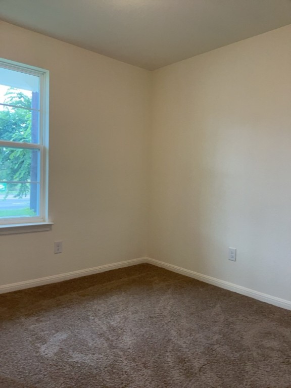 2002 West 2nd Street, Unit 1400 Taylor, TX 76574 - Photo 8 of 14 Bedroom with carpet and baseboards