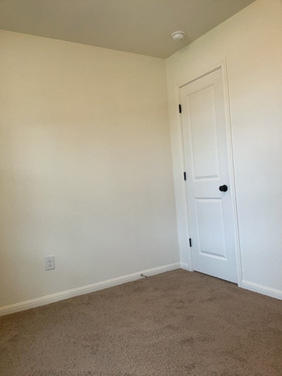 2002 West 2nd Street, Unit 1400 Taylor, TX 76574 - Photo 10 of 14 Bedroom with carpet floors and closet