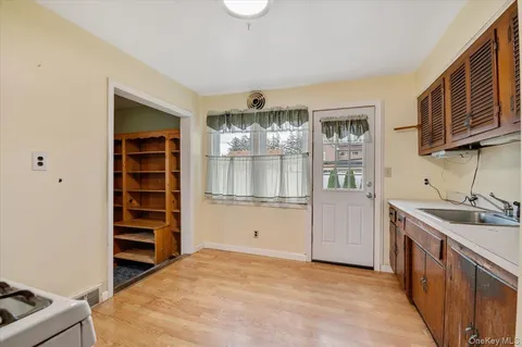a kitchen with stainless steel appliances granite countertop a stove and a sink