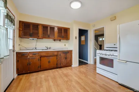 a kitchen with stainless steel appliances granite countertop a stove and a sink