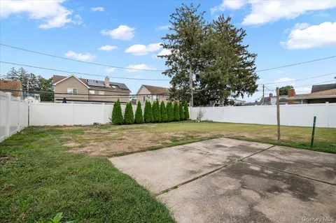 a view of a backyard of the house