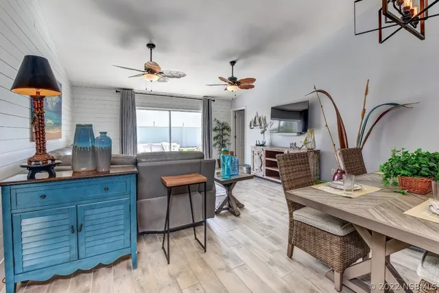 a view of a livingroom with furniture and staircase