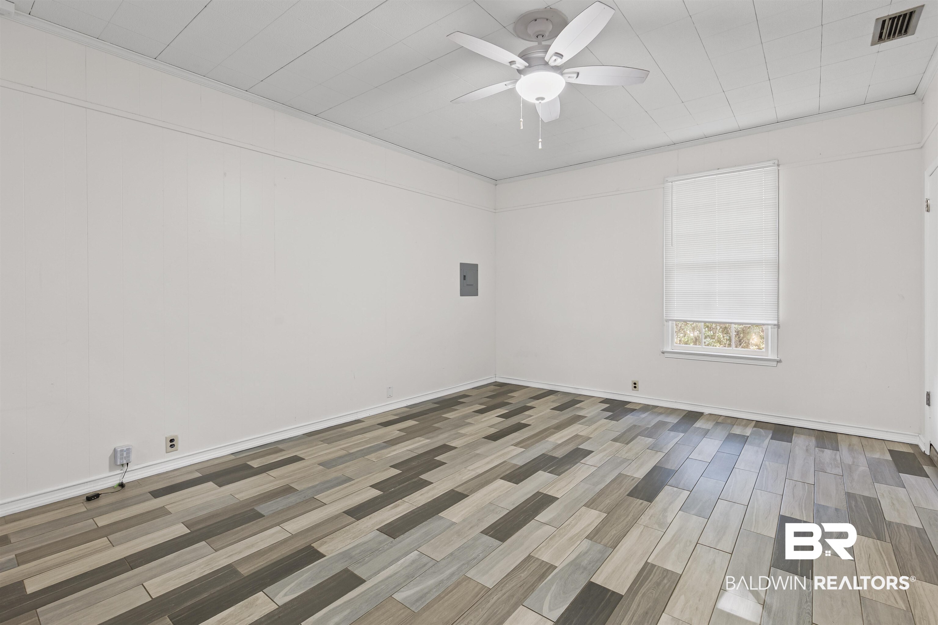 1108 Locarno Street Mobile, AL 36608 - Photo 5 of 24 Unfurnished room featuring wood tiled floors and ceiling fan