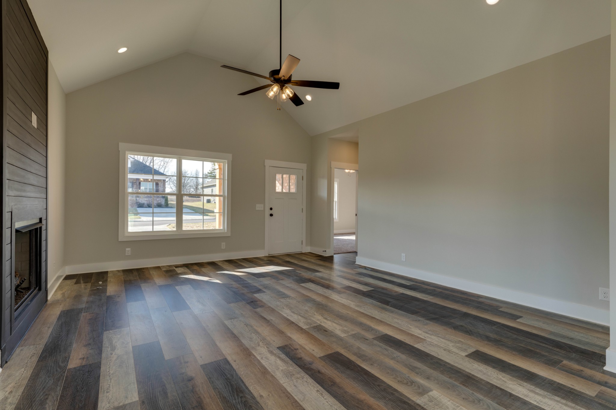 155 Julia Ann Court Springfield, TN 37172 - Photo 4 of 17 a view of an empty room with wooden floor fireplace and a window