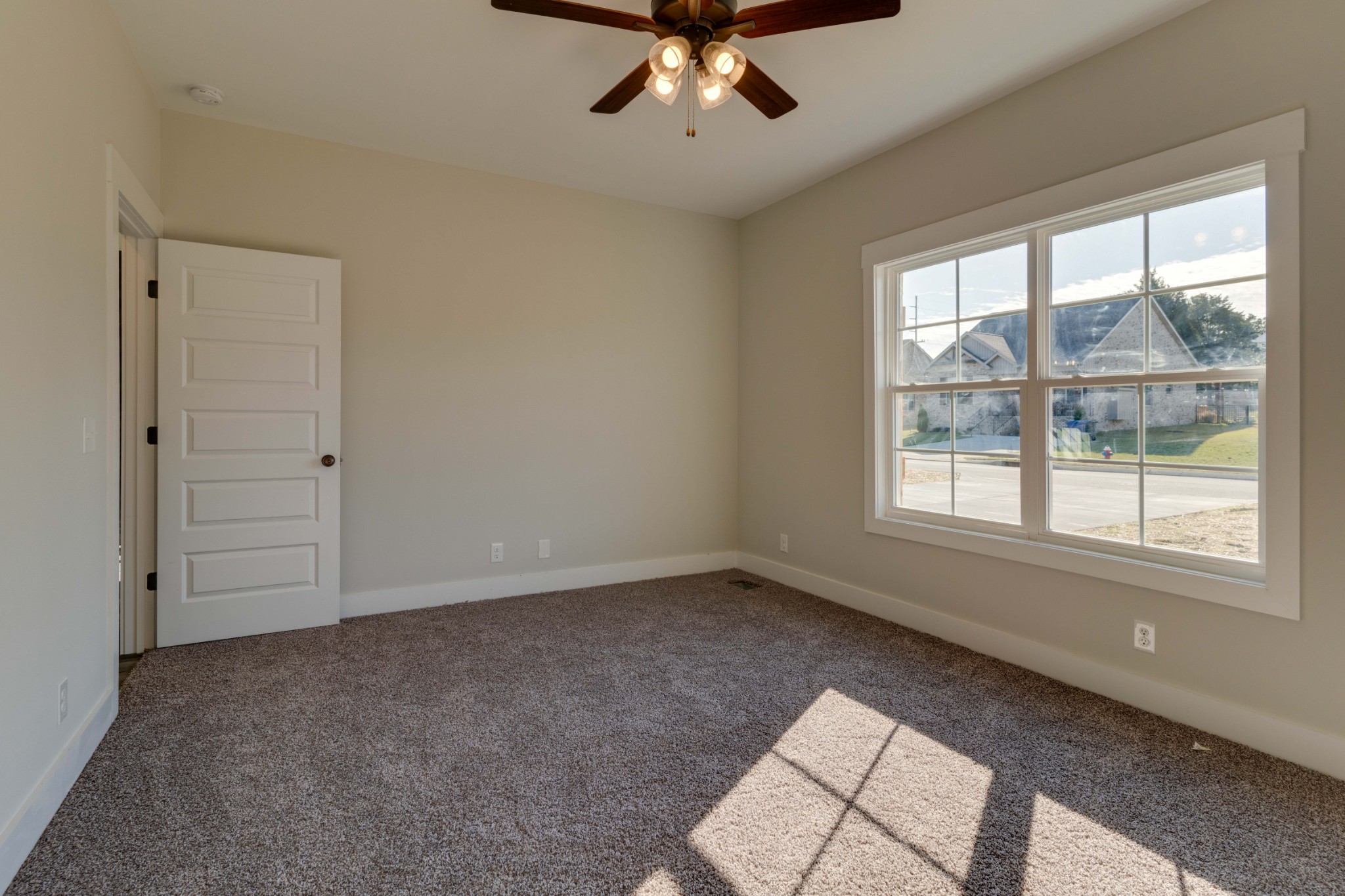 155 Julia Ann Court Springfield, TN 37172 - Photo 7 of 17 an empty room with chandelier fan and windows