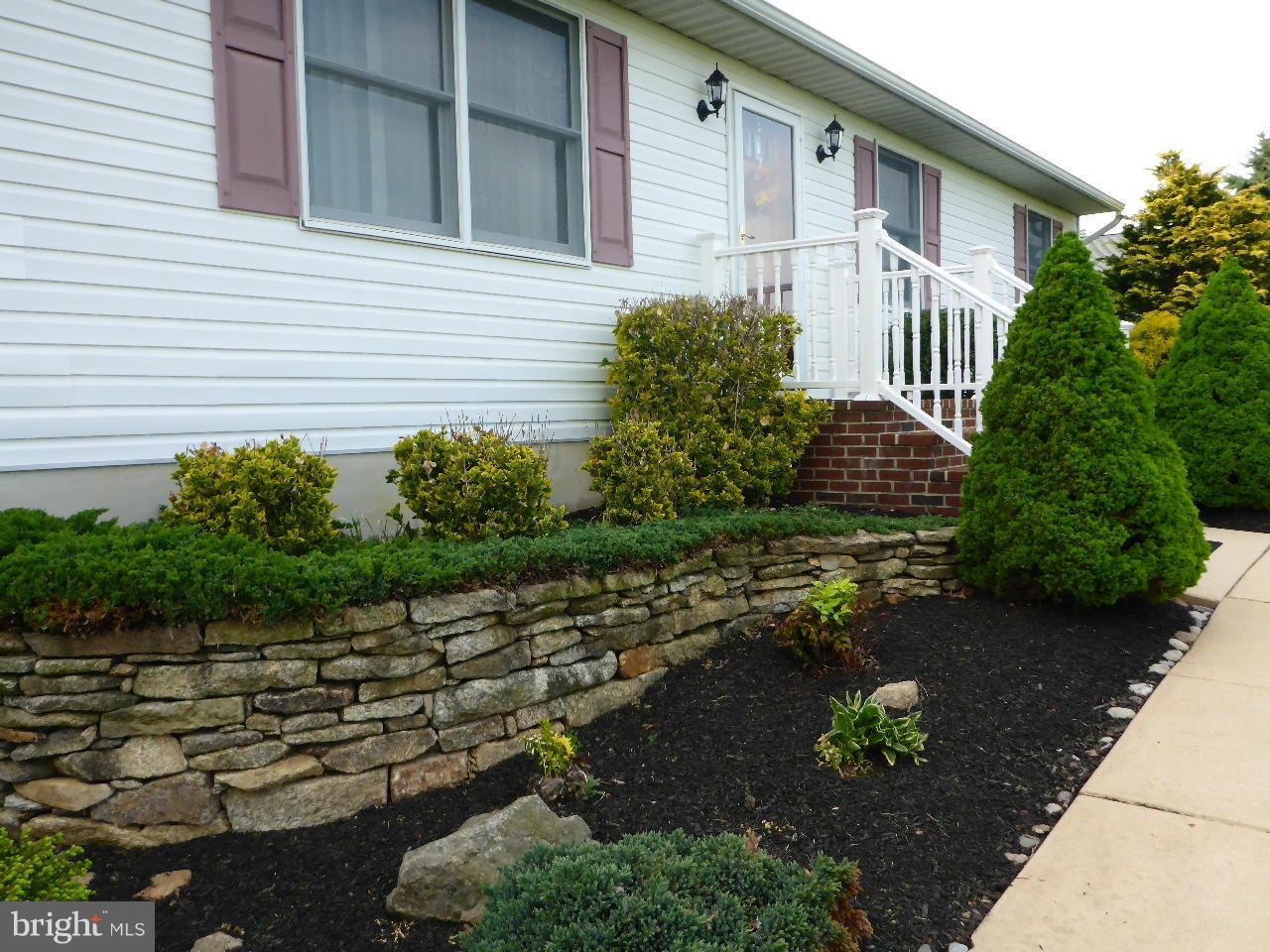 37 Surrey Lane Rising Sun, MD 21911 - Photo 2 of 30 a front view of a house with a yard and a garden
