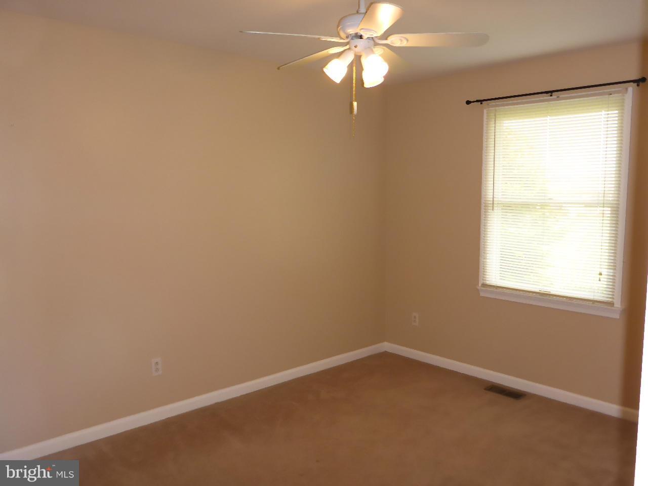 37 Surrey Lane Rising Sun, MD 21911 - Photo 18 of 30 an empty room with a window and a fan