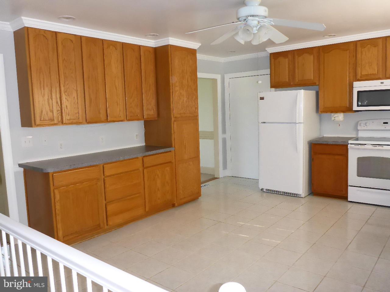 37 Surrey Lane Rising Sun, MD 21911 - Photo 9 of 30 a view of a kitchen with microwave and refrigerator