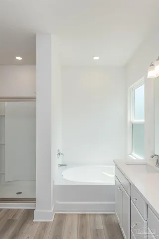 a bathroom with a bathtub and a sink