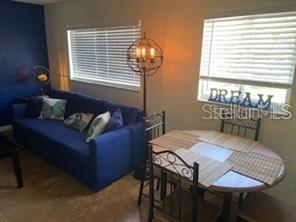 3206 West Azeele Street, Unit 220 Tampa, FL 33609 - Photo 3 of 9 a view of a dining room with furniture and window