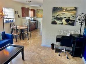 3206 West Azeele Street, Unit 220 Tampa, FL 33609 - Photo 4 of 9 a view of a dining room with furniture