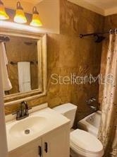 3206 West Azeele Street, Unit 220 Tampa, FL 33609 - Photo 7 of 9 a bathroom with a sink toilet and shower