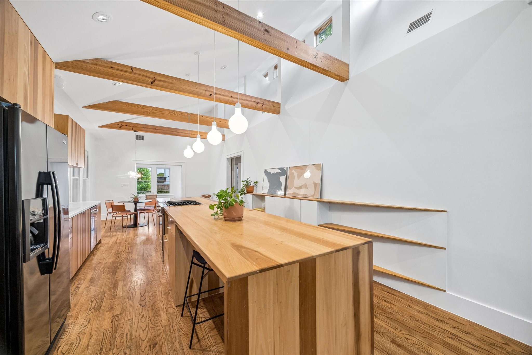 1603 Fulton Street Houston, TX 77009 - Photo 13 of 28 Please take note of the ribbon windows at the peak of the ceiling, bringing in so much natural light!