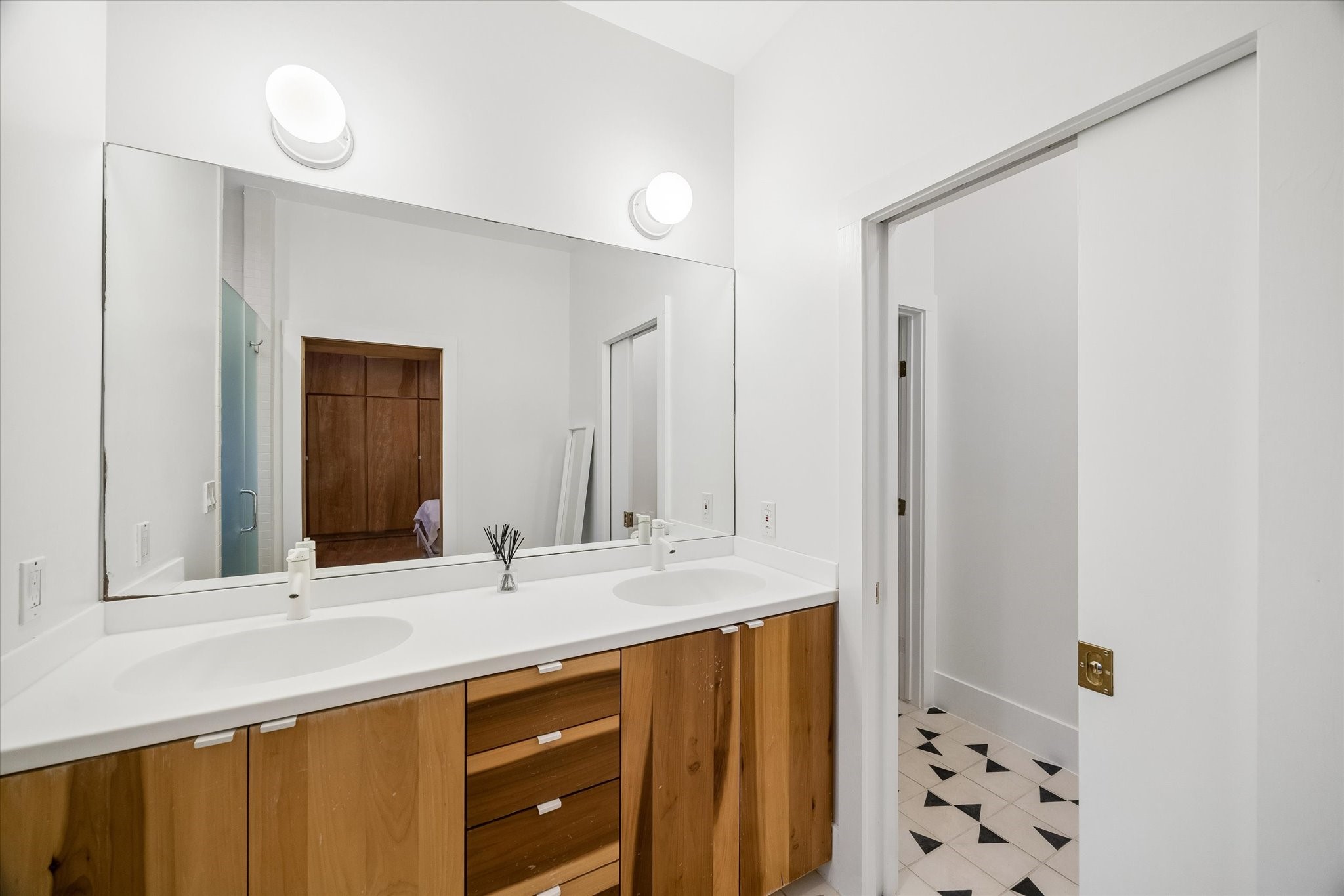 1603 Fulton Street Houston, TX 77009 - Photo 20 of 28 Primary bath features double sinks, custom flooring and a beautiful walk-in shower.