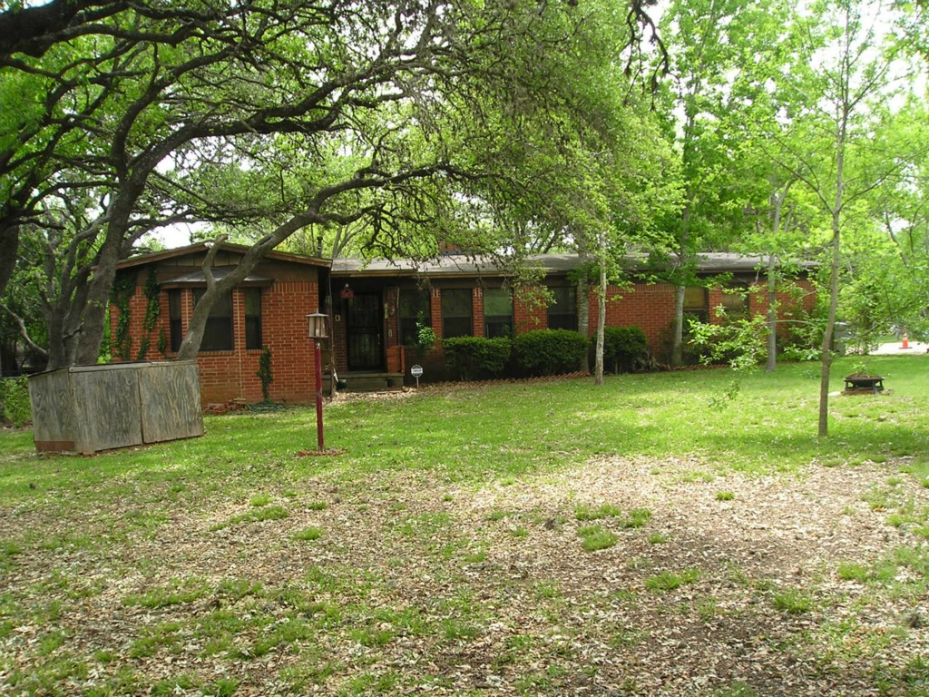 7507 Sherwood Road Austin, TX 78745 - Photo 1 of 1 a view of a house with backyard and a tree