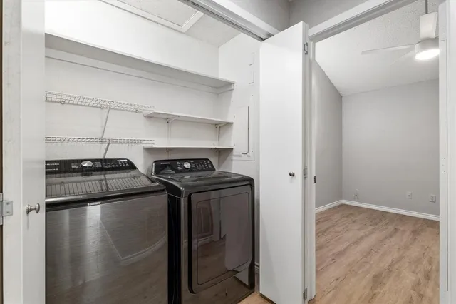 a kitchen with stainless steel appliances granite countertop a refrigerator stove top oven and sink