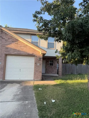 a view of a backyard with a small cabin