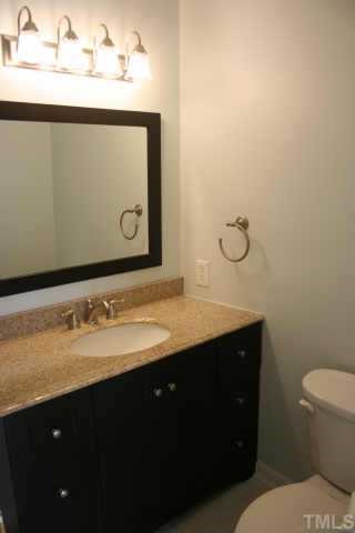 4204 Frost Court Raleigh, NC 27609 - Photo 4 of 6 Hall bath with granite, new tile, and countertops.